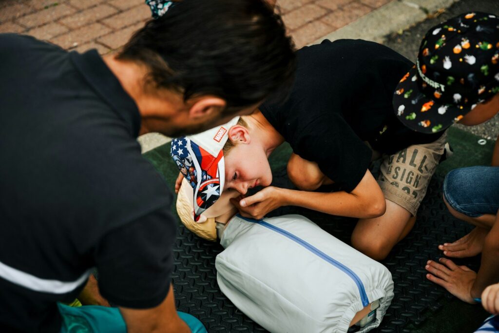 Nos formations a young boy getting his hair cut by a man